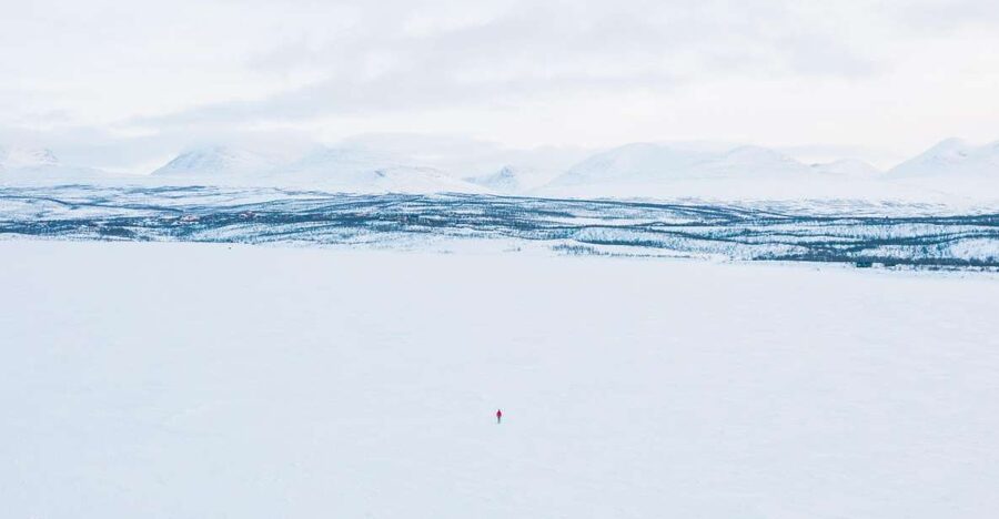 Abisko: Lake Torneträsk Arctic Ice Fishing Trip - The moment you drill the hole and start fishing