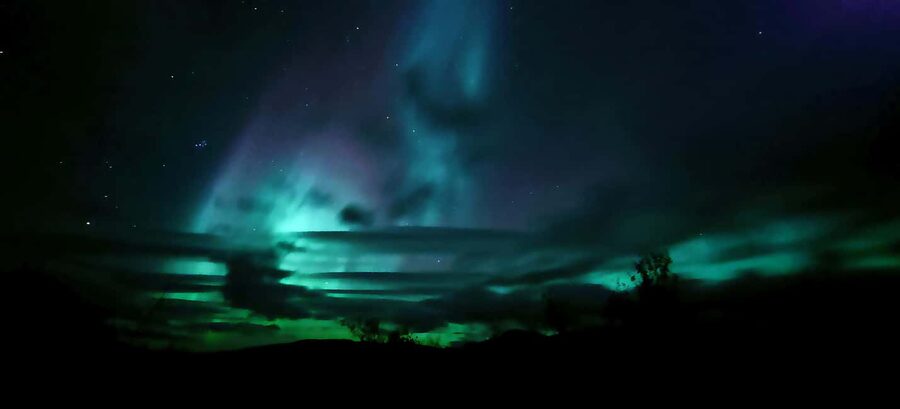 Abisko: Northern Lights Hike with Husky Puppies - Walking toward the tipi: a gentle rhythm of night, cold, and anticipation
